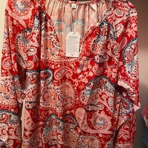 Brand new woman’s loose fitting top.